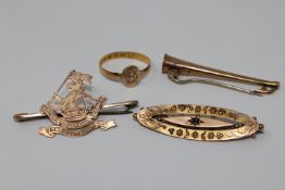 Three gold brooches and a 22ct gold ring CONDITION REPORT: The 22ct gold ring is 1.