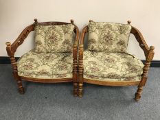 A pair of 20th century mahogany tub chairs in floral fabric