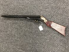 A mid 20th century child's spring action double barrel toy gun