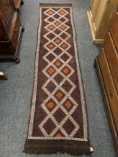 A Meshwani carpet runner 253 cm x 66 cm