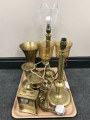 A tray of brass table lamps, candle holders,