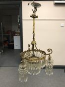 A late 19th century gilt metal and glass chandelier with glass drops CONDITION REPORT:
