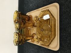 A tray of five piece amber glass trinket set together with an amber glass water jug,