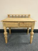 A pine low table fitted two drawers