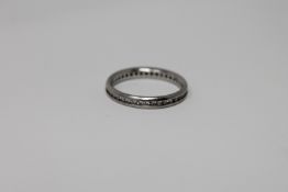 A platinum diamond eternity ring,