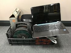 A box containing three laptops, including two HP and one Time.