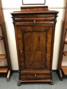 A 19th century mahogany cabinet, fitted with two drawers,