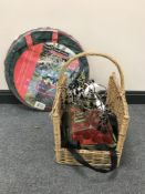 A garden tidy bag together with a wicker log basket, a light fitting,