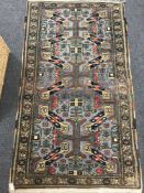 A fringed Caucasian woollen rug