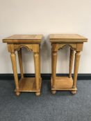 A pair of contemporary two tier plant tables