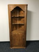 A pine corner cupboard