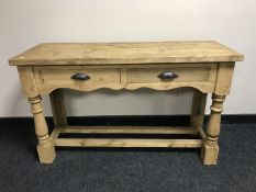 A reclaimed pine two drawer kitchen work table