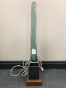A 20th century Stewart Finley glass and wood table lamp