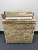 A wicker laundry basket together with a box containing five rolls of William Morris & Company