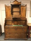 A 19th century inlaid oak cylinder bureau bookcase,