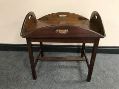 A mahogany butler's tray on stand