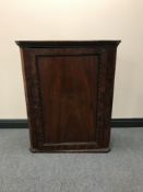 A Victorian mahogany hanging corner cabinet