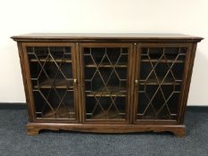 A Victorian inlaid mahogany triple door glazed bookcase, width 154 cm.
