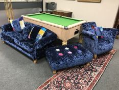 A contemporary three-piece lounge suite, comprising of a three seater settee,