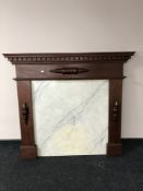 An oak fire surround with marble back