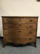 A 19th century Chippendale style mahogany serpentine fronted four drawer chest on long bracket feet,