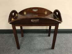 A mahogany butler's tray on stand