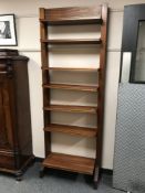 A mid 20th century teak adjustable bookcase, width 74.