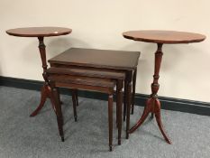 A pair of mahogany wine tables and a nest of three tables