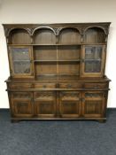 A Priory oak four door dresser