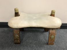 A camel stool and a teak effect lamp table
