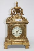A brass striking eight day mantel clock
