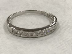 A silver cz half eternity dress ring