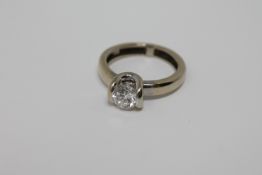 A fine quality 18ct gold solitaire diamond ring, the brilliant cut stone weighing an estimated 1.