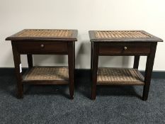 A pair of wicker topped two tier bedside tables,