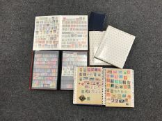 A basket of five stamp albums with stamps