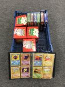 A basket containing a Pokemon trading card folder with cards,