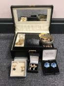 A box of vintage costume jewellery including earrings, cufflinks,