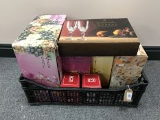 A basket containing a quantity of boxed glassware including two RCR vases, cascade fruit set,