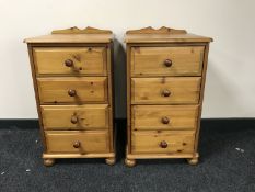 A pair of pine four drawer bedside chests