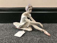 A Lladro figure depicting a seated ballerina a/f