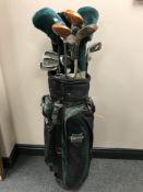 A golf bag containing a set of Hippo irons, assorted drivers,