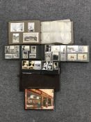 A tray of vintage photo albums containing monochrome photos