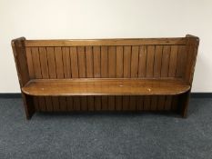 A pine pew CONDITION REPORT: This measures 192cm long, 45cm deep and 96cm high.