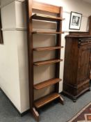 A mid 20th century teak adjustable bookcase, width 74.