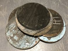 Seven whiskey barrel lids