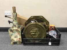 A box containing a brass embossed magazine rack, an octagonal brass tray, mid 20th century pottery,