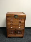 A oriental style cutlery cabinet