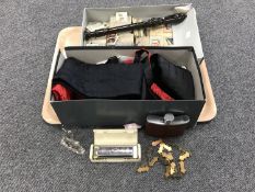 A tray containing a Hohner big river harp, assorted cigarette and tea cards, a Yamaha recorder,