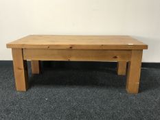 A rectangular pine coffee table