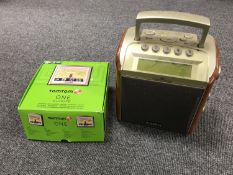 A boxed Tom Tom 1 Europe sat nav with a Roberts DAB radio